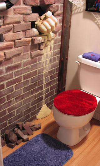 Illustration for article titled In this Spider-Man themed bathroom, The Lizard is watching you poop